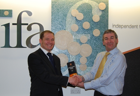 Ivan Houston receives his bottle of Highland Park whisky